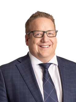 Professional portrait of Richard Brown, against a clean background.